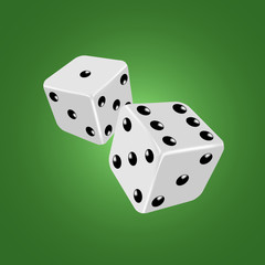 Two white dices on the green background