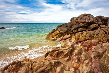 Stones tropical beach under blue sky. Thailand