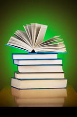 Stack of books against gradient background