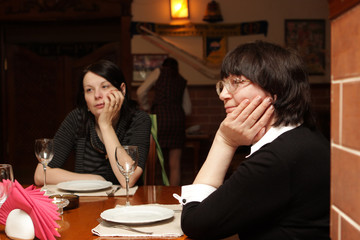 Two women wats a food