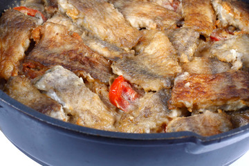 Braised fish in a frying pan