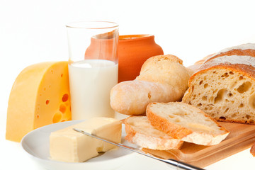 piece of butter, bread and a knife