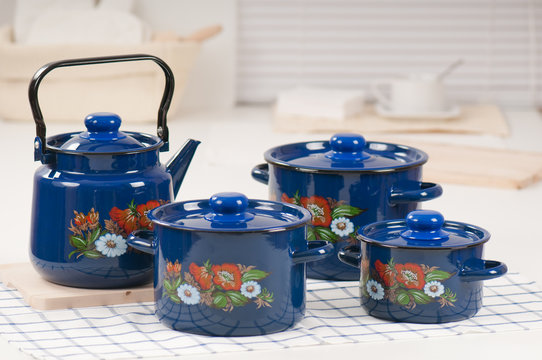 Kitchen utensil set of blue pots and kettle