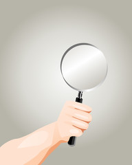 Hand holding Magnifying glass