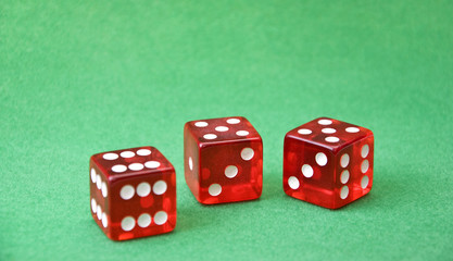 Row of dice on green background