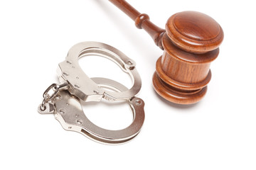 Gavel and Handcuffs on White