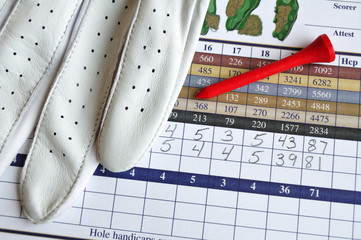 Golf Score Card with Glove and Red Tee