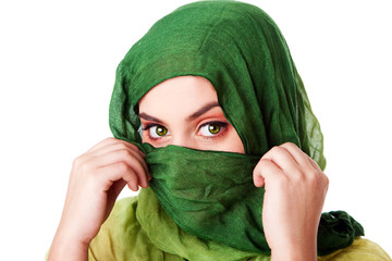 Face with green eyes and scarf