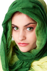 Face with green eyes and scarf