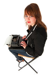 Fototapeta na wymiar Funny girl with black typewriter