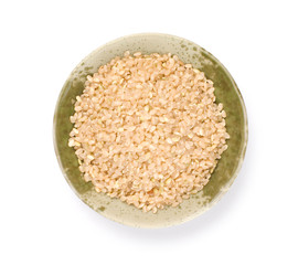 Isolated brown rice in bowl