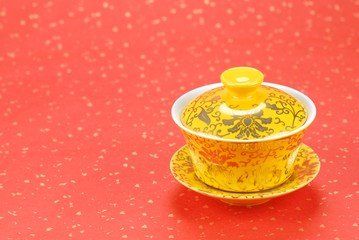 Traditional asian teacup on festive background