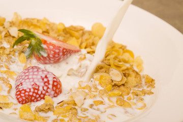 Cereal with milk and strawberry