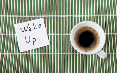 Cup of coffee on a bamboo background.