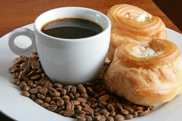 a cup of coffee, grain and bread