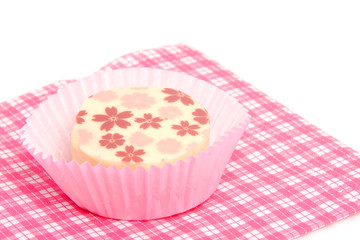 petit four on napkin over white background