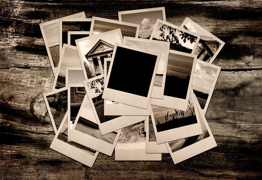 Stack of photo shots on wooden background