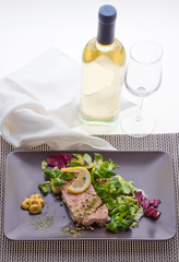 Salmon dish with salad
