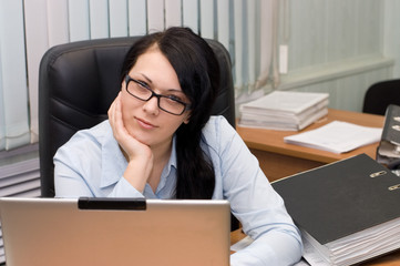 young girl at office behind a table