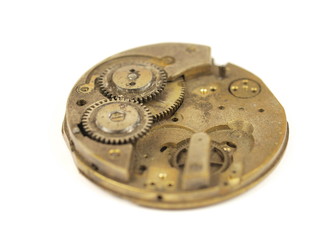 Old clock mechanism on white background
