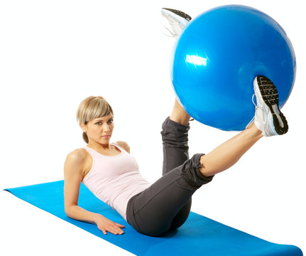 Sportswoman exercising with a Fitness Ball