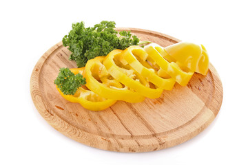 Orange pepper and parsley on white background