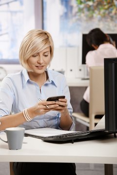 Businesswoman using mobile