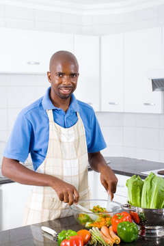 african american man making salad