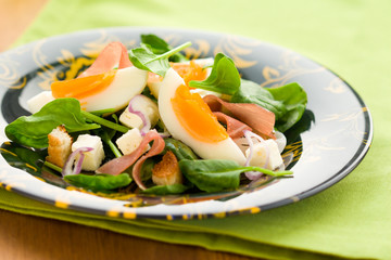 spring salad with spinach,egg,ham and feta