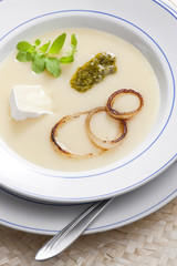 onion soup with pesto and brie cheese