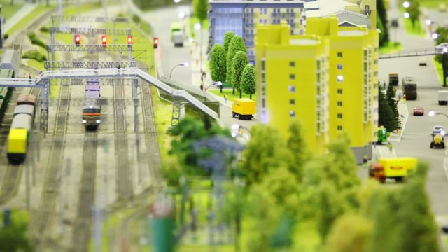 in small model city trian arrives to wayside station