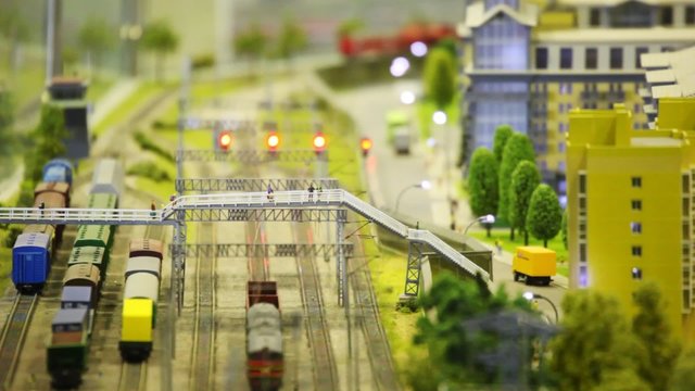 in small model city cargo train passes on rail
