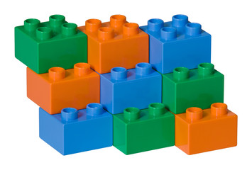 Green, blue and orange plastic toy bricks