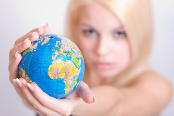 Globe in women`s hands