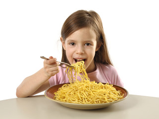 Little girl eating spaghetti