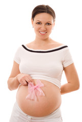 pregnant woman holding a bow on his stomach on a white backgroun