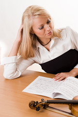 woman sitting at a table on a white