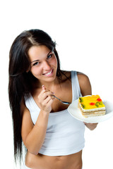 Attractive woman eating cake