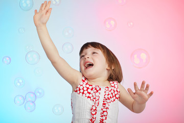 Child playing with soap bubbles