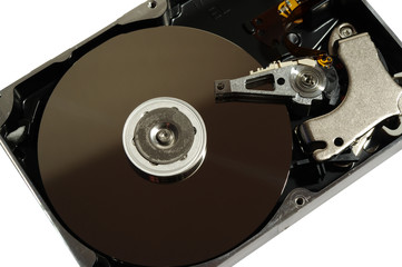 Opened hard disk drive on white background