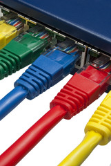 Multi coloured ethernet network plugs connected to a router