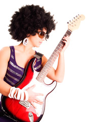 young guitarist girl holding guitar over white
