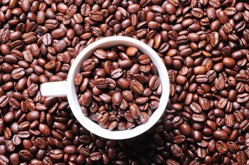 Cup full of coffee beans