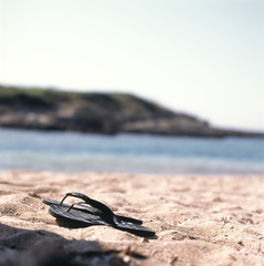 Fototapeta na wymiar Flip-flops on the beach