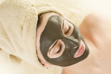 Spa.Mud Mask on the beautiful woman's face