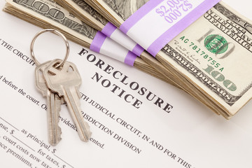 House Keys, Stack of Money and Foreclosure Notice