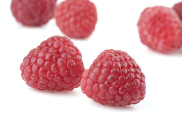 Raspberries on a white background