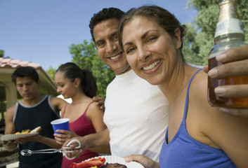 two couples at outdoor picnic.