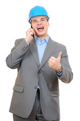 engineer with blue hard hat talking on cell phone