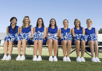 cheerleaders sitting on bench (portrait)